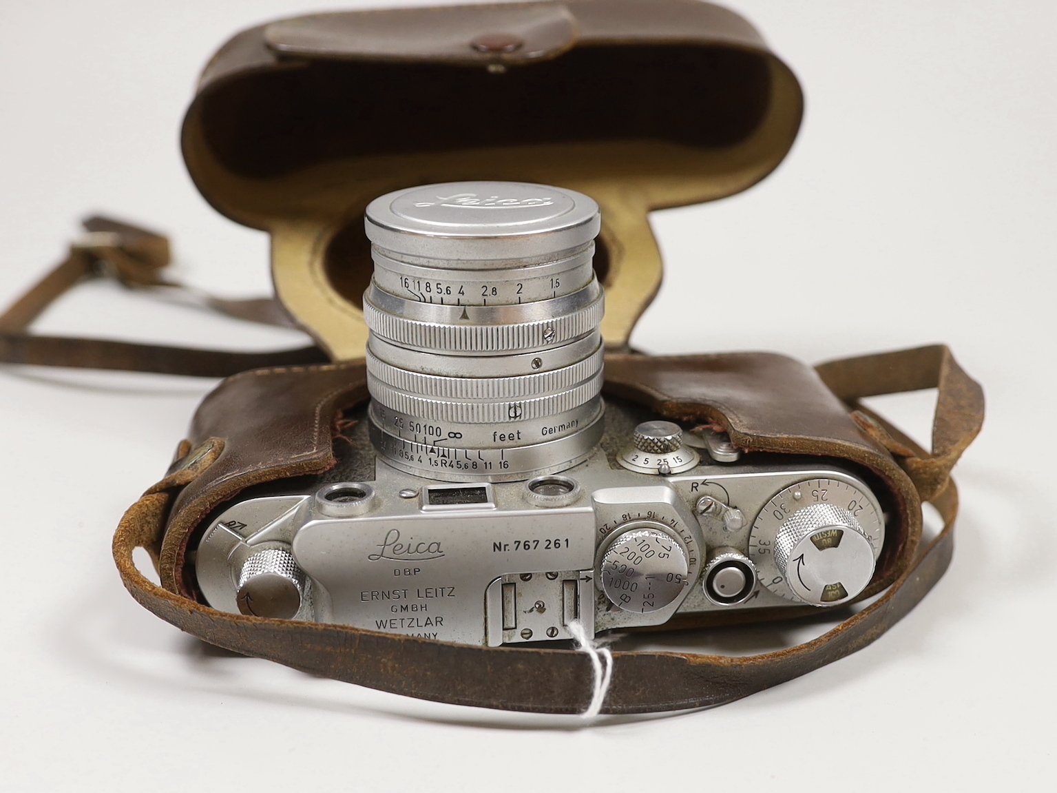 A cased Leica III camera serial number 767261 with Ernst Leitz GmbH Wetzlar Summarit f=5cm 1:15 No.135729 lens and light exposure meter